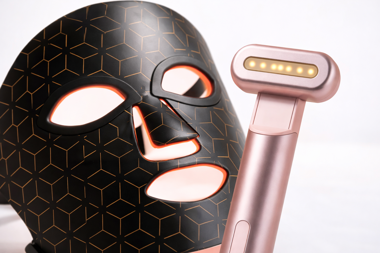 Close-up of an LED facial mask and rose-gold handheld skincare device shown together as a combo.