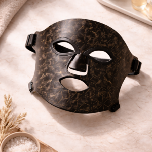 Dermaheal Pro LED face mask styled with towel, serum, and bath salt decor.